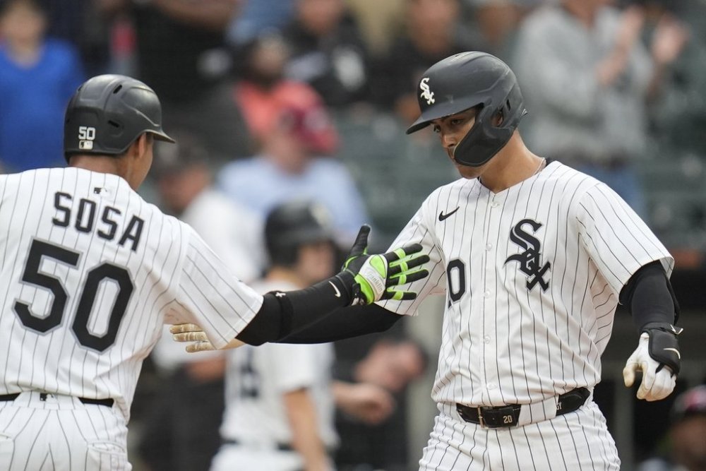 CORRECTS INNING - Chicago White Sox's Miguel Vargas (20), right, and Lenyn Sosa (50) celebrate Vargas' three-run home run during the seventh inning of a baseball game against the Philadelphia Phillies, Wednesday, July 30, 2025, in Chicago. (AP Photo/Erin Hooley)