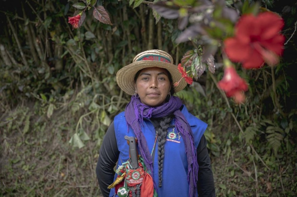 Patricia Elago Zetty, an Indigenous Guard, poses for a photo on July 16, 2025, in Caldono, Colombia. (AP Photo/Nadège Mazars)