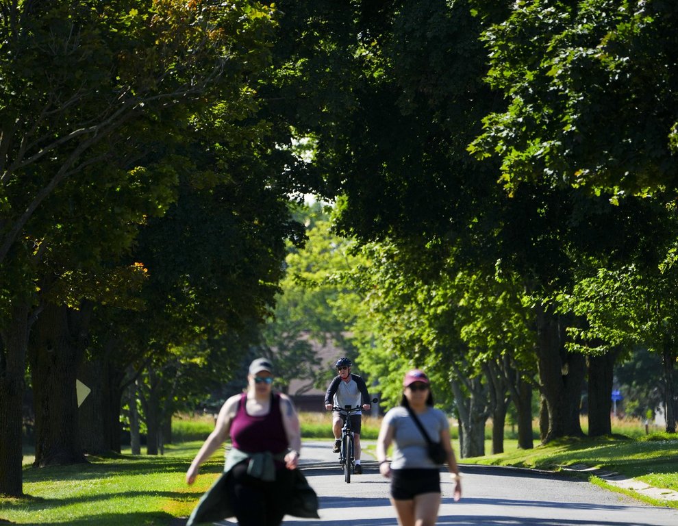 People make their way along Morningside Lane in Ottawa on Wednesday, July 13, 2022. THE CANADIAN PRESS/Sean Kilpatrick