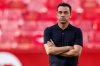 FILE - Barcelona's head coach Xavi Hernandez watches before the Spanish La Liga soccer match between Sevilla and FC Barcelona at the Ramon Sanchez Pizjuan stadium in Seville, Spain, Sunday, May 26, 2024. (AP Photo/Fermin Rodriguez, File)