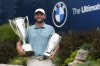 Scottie Scheffler poses with the trophies after winning the BMW Championship golf tournament Sunday, Aug. 17, 2025, in Owings Mills, Md. (AP Photo/Stephanie Scarbrough)