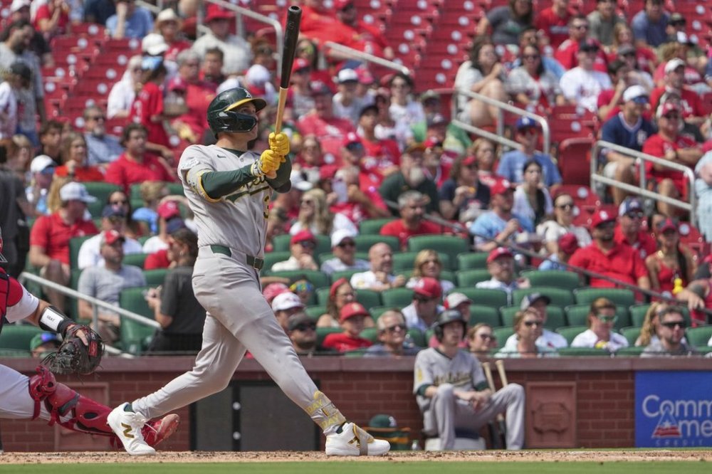 Athletics' JJ Bleday follows through on a two-run home run during the fourth inning of a baseball game against the St. Louis Cardinals Monday, Sept. 1, 2025, in St. Louis. (AP Photo/Jeff Roberson)