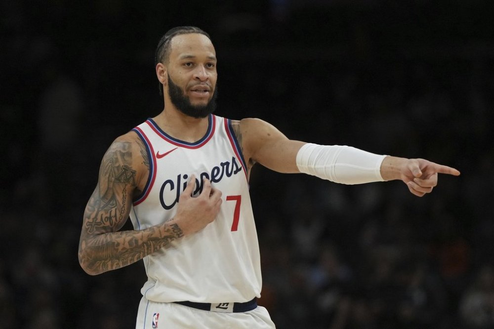 FILE - LA Clippers guard Amir Coffey points during the first half of an NBA basketball game against the Phoenix Suns, Tuesday, March 4, 2025, in Phoenix. (AP Photo/Rick Scuteri, File)