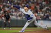 Los Angeles Dodgers starting pitcher Yoshinobu Yamamoto delivers during the third inning of a baseball game against the Baltimore Orioles, Saturday, Sept. 6, 2025, in Baltimore. (AP Photo/Stephanie Scarbrough)