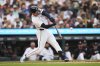 Detroit Tigers' Dillon Dingler hits a one-run triple against the Houston Astros pitcher in the first inning during a baseball game Wednesday, Aug. 20, 2025, in Detroit. (AP Photo/Paul Sancya)