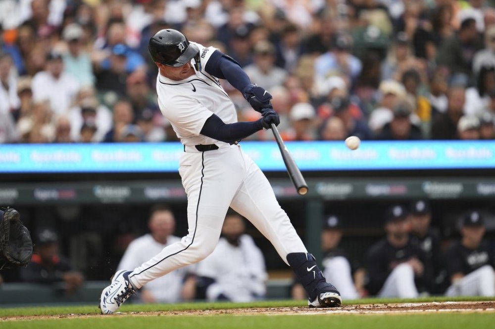 Detroit Tigers' Dillon Dingler hits a one-run triple against the Houston Astros pitcher in the first inning during a baseball game Wednesday, Aug. 20, 2025, in Detroit. (AP Photo/Paul Sancya)