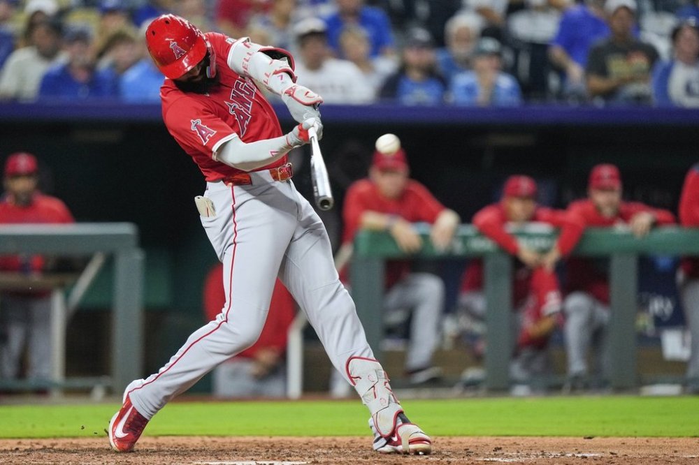Los Angeles Angels' Jo Adell hits a three-run home run during the sixth inning of a baseball game against the Kansas City Royals, Wednesday, Sept. 3, 2025, in Kansas City, Mo. (AP Photo/Charlie Riedel)
