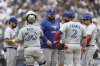 Toronto Blue Jays manager John Schneider, centre, stands on the mound after pulling Max Scherzer during the fifth inning of a baseball game against the New York Yankees, Sunday, Sept. 7, 2025, in New York. (AP Photo/Heather Khalifa)