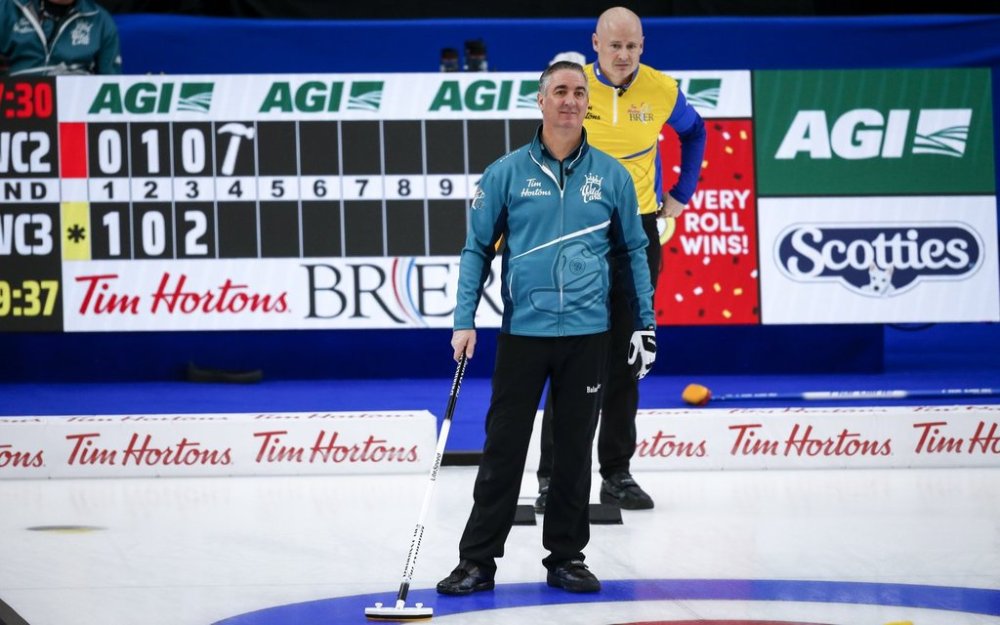 Team Wild Card Three alternate Wayne Middaugh, left, directs his teammates as Team Wild Card Two skip Kevin Koe looks on at the Brier in Calgary, Alta., Saturday, March 13, 2021. THE CANADIAN PRESS/Jeff McIntosh