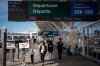 Strike supporters march around the departures level at the Vancouver International Airport in Richmond, B.C., on Sunday, Aug. 17, 2025. Air Canada made the call to halt a return to operation as flight attendants continue to strike. THE CANADIAN PRESS/Ethan Cairns