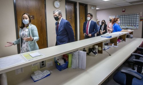 FILE - Health Director Lillian B. Koontz leads North Carolina Gov. Roy Cooper on a tour of the COVID-19 vaccine clinic at the Davidson County Health Department in Lexington, N.C., June 17, 2021. (Woody Marshall/News & Record via AP, File)