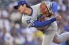 Los Angeles Dodgers starting pitcher Shohei Ohtani works against the Colorado Rockies in the second inning of a baseball game, Wednesday, Aug. 20, 2025, in Denver. (AP Photo/David Zalubowski)