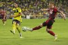 Toronto FC midfielder Matty Longstaff, right, kicks the ball past Nashville SC midfielder Gastón Brugman, left, during the first half of an MLS soccer match Saturday, July 19, 2025, in Nashville, Tenn. (AP Photo/George Walker IV)
