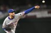 New York Mets starting pitcher David Peterson throws during the second inning of a baseball game against the Washington Nationals Tuesday, Aug. 19, 2025, in Washington. (AP Photo/John McDonnell)