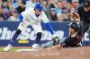 Blue Jays third baseman Ernie Clement (top) tags out Minnesota Twins outfielder Matt Wallner (38) at third base during the eighth inning of a Major League Baseball game in Toronto on Tuesday, Aug. 26, 2025. THE CANADIAN PRESS/Frank Gunn