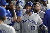 Kansas City Royals' Salvador Perez celebrates with teammates after hitting a solo home run during the fifth inning of a baseball game against the Chicago White Sox in Chicago, Wednesday, Aug. 27, 2025. (AP Photo/Nam Y. Huh)