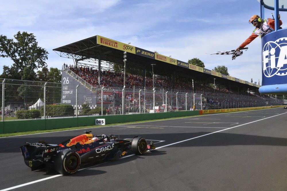 Red Bull driver Max Verstappen of the Netherlands crosses the finish line to win the Italian Grand Prix race at the Monza racetrack in Monza, Italy, Sunday, Sept. 7, 2025. (Marco Bertorello/Pool Photo via AP)