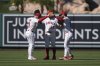 Los Angeles Angels' Taylor Ward (3), Chris Taylor (33) and Matthew Lugo (15) celebrate the team's win in a baseball game against the Athletics Sunday, Sept. 7, 2025, in Anaheim, Calif. (AP Photo/Jae C. Hong)