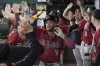 Arizona Diamondbacks' Ketel Marte celebrates in the dugout with the team after hitting a three-run home run in the ninth inning of a baseball game against the Texas Rangers Wednesday, Aug. 13, 2025, in Arlington, Texas. (AP Photo/Tony Gutierrez)