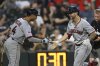 Cleveland Guardians' C.J. Kayfus, right, celebrates with teammate Brayan Rocchio, after hitting a solo home run during the sixth inning of a baseball game against the Chicago White Sox, Saturday, Aug. 9, 2025, in Chicago. (AP Photo/Paul Beaty)