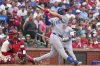 Chicago Cubs' Michael Busch follows through on a three-run home run during the second inning of a baseball game against the St. Louis Cardinals Saturday, Aug. 9, 2025, in St. Louis. (AP Photo/Jeff Roberson)