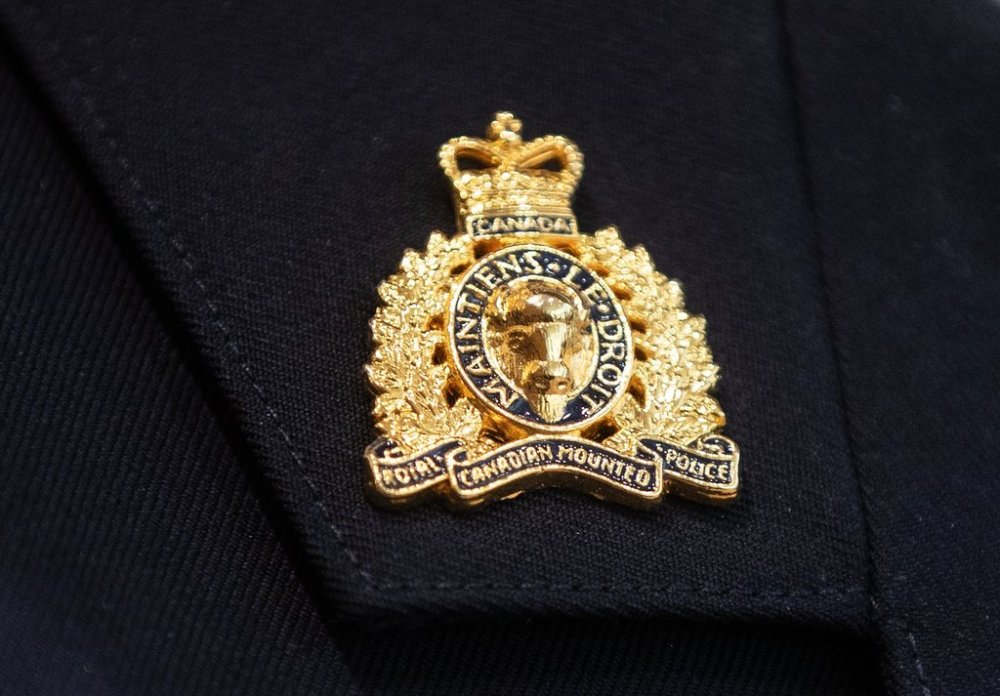 An RCMP collar tab pin is seen in Edmonton, Wednesday, Feb. 5, 2025. THE CANADIAN PRESS/Jason Franson