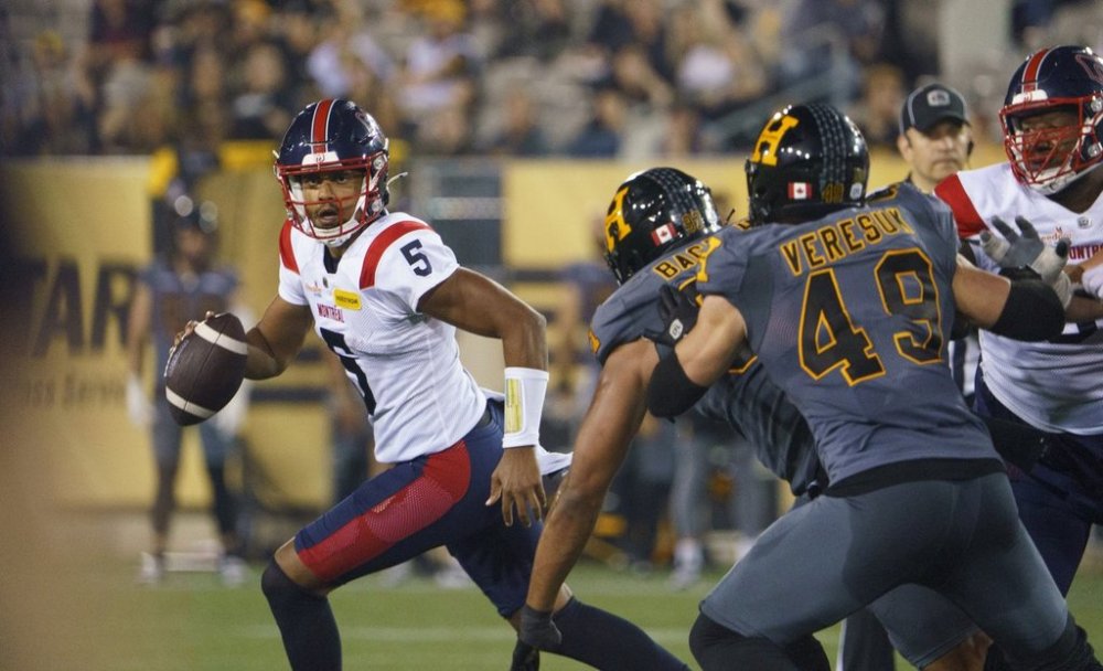 Montreal Alouettes quarterback Caleb Evans (5) scrambles during second half CFL football game action against the Hamilton Tiger-Cats in Hamilton, Ont. on Friday, June 27, 2025. THE CANADIAN PRESS/Peter Power