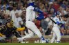 Chicago Cubs' Michael Busch hits a three-run double during the third inning of a baseball game against the Milwaukee Brewers, Wednesday, Aug. 20, 2025, in Chicago. (AP Photo/Erin Hooley)