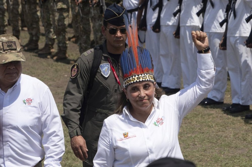 Peru's President Dina Boluarte reviews troops during a visit to Santa Rosa, Peru, an island on the Amazon River at the triple border with Colombia and Brazil, amid a territorial dispute with Colombia, Friday, Aug. 15, 2025. (AP Photo/Daniel Padilla)