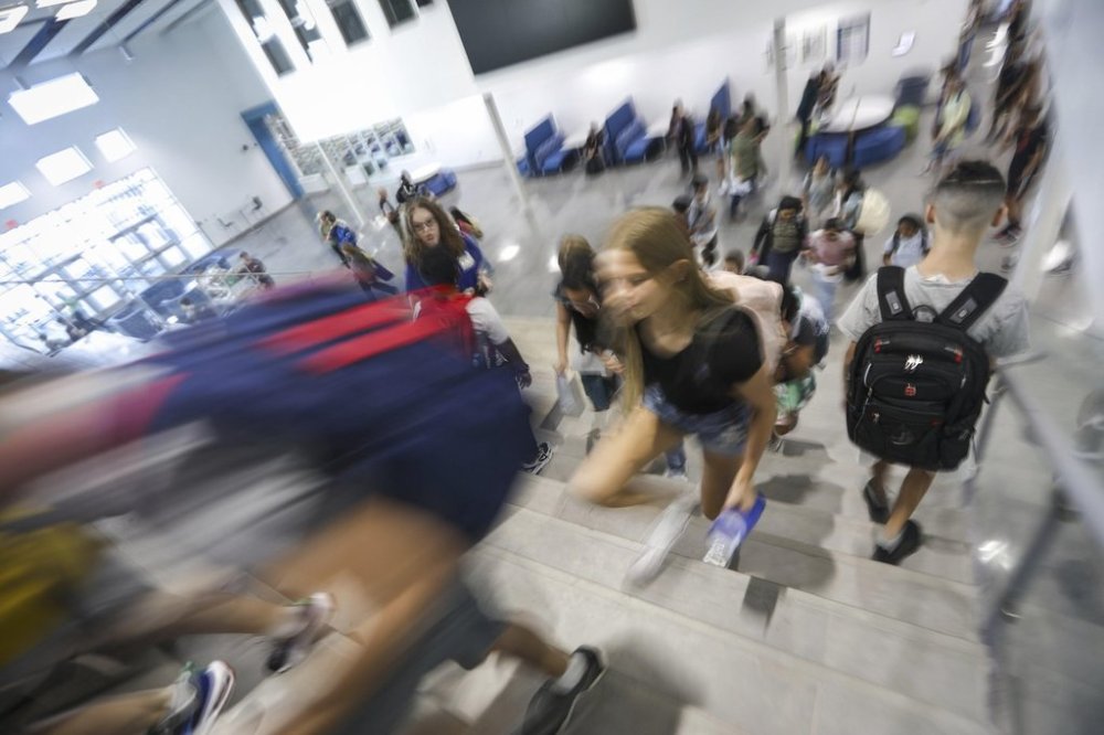 FILE - Students make their way to classes on the first day of school in Land O' Lakes, Fla., Thursday, Aug. 10, 2023. (Chris Urso/Tampa Bay Times via AP, File)