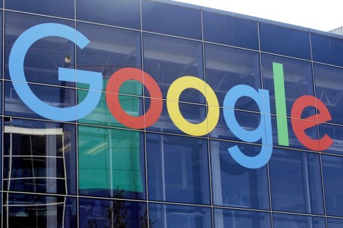 FILE - A sign is displayed on a Google building at their campus in Mountain View, Calif., Sept. 24, 2019. (AP Photo/Jeff Chiu, File)