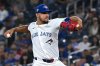 Toronto Blue Jays starting pitcher Jose Berrios (17) throws to a Texas Rangers batter in first inning MLB baseball action in Toronto on Sunday, Aug. 17, 2025. THE CANADIAN PRESS/Jon Blacker