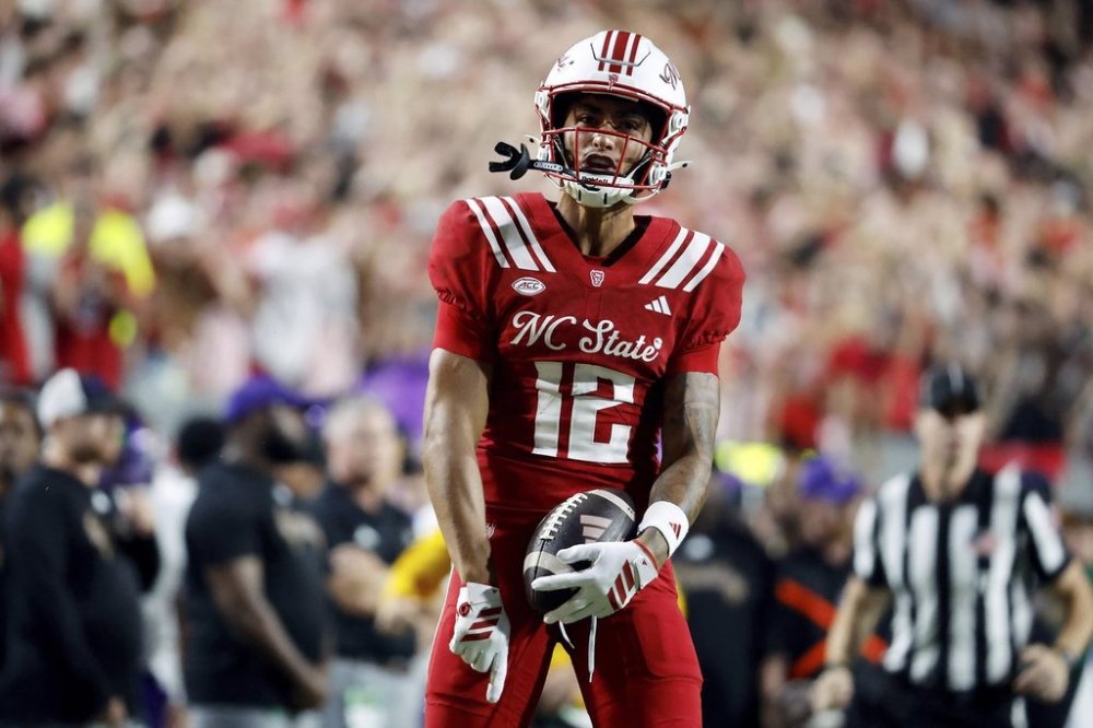 North Carolina State's Teddy Hoffmann (12) celebrates after a reception against East Carolina during the second half of an NCAA college football game in Raleigh, N.C., Thursday, Aug. 28, 2025. (AP Photo/Karl DeBlaker)