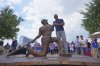Former Texas Rangers player Adrian Beltre, center, looks at a statue of himself after it was unveiled before a baseball game between the Cleveland Guardians and the Rangers, Friday, Aug. 22, 2025, in Arlington, Texas. (AP Photo/LM Otero)