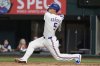 Texas Rangers shortstop Corey Seager follows through on a solo home run swing in the fourth inning of a baseball game against the Los Angeles Angels, Wednesday, Aug. 27, 2025, in Arlington, Texas. (AP Photo/Tony Gutierrez)