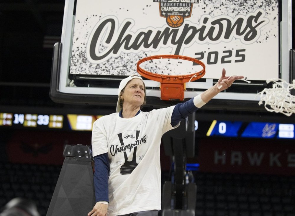 FILE - UC San Diego head coach Heidi VanDerveer throws the net to her team as they celebrate after defeating UC Davis in an NCAA college basketball game in the championship of the Big West Conference tournament, March 15, 2025, in Henderson, Nev. (AP Photo/Ronda Churchill)