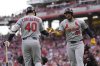 St. Louis Cardinals designated hitter Iván Herrera (48) celebrates with Willson Contreras (40) after hitting a solo home run during the first inning of a baseball game against the Cincinnati Reds Friday, Aug. 29, 2025, in Cincinnati. (AP Photo/Carolyn Kaster)