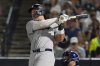 New York Yankees' Aaron Judge watches his solo home run off Tampa Bay Rays pitcher Shane Baz during the first inning of a baseball game Tuesday, Aug. 19, 2025, in Tampa, Fla. (AP Photo/Chris O'Meara)
