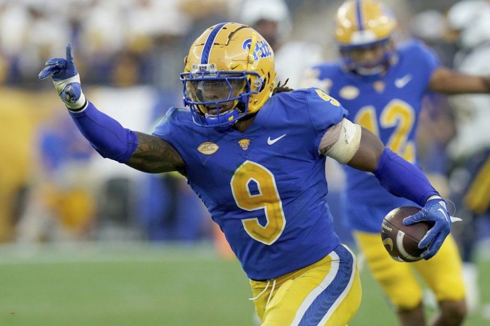 FILE - Pittsburgh linebacker Kyle Louis (9) celebrates after intercepting a ball during the second half of an NCAA college football game against West Virginia, Saturday, Sept. 14, 2024, in Pittsburgh. (AP Photo/Matt Freed, File)