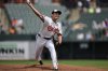 Baltimore Orioles starting pitcher Tomoyuki Sugano delivers during the first inning of a baseball game against the Seattle Mariners, Thursday, Aug. 14, 2025, in Baltimore. (AP Photo/Stephanie Scarbrough)