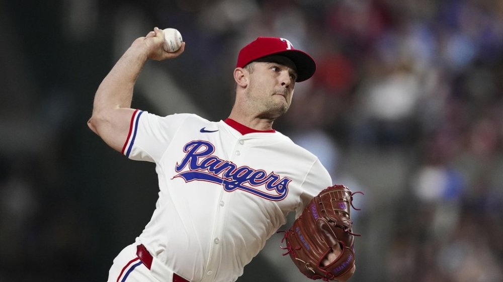 FILE - Texas Rangers relief pitcher David Robertson throws during the eighth inning of a baseball game against the Houston Astros, Monday, Aug. 5, 2024, in Arlington, Texas. (AP Photo/Sam Hodde, file)