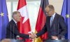 Prime Minister Mark Carney, left and German Chancellor Friedrich Merz shake hands following a joint media availability at the Federal Chancellery in Berlin, Germany on Tuesday, Aug. 26, 2025. THE CANADIAN PRESS/Christinne Muschi