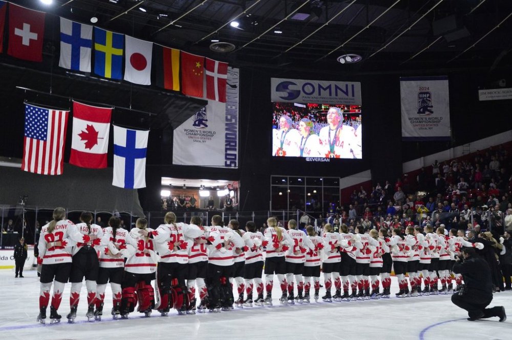 Canada's women's national team stands for their national anthem as flags are raised after their win against the United States in the final of the IIHF Women's World Hockey Championships in Utica, N.Y., Sunday, April 14, 2024. THE CANADIAN PRESS/AP-Adrian Kraus