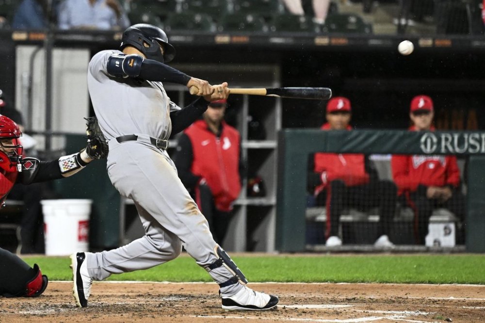 New York Yankees' Trent Grisham hits a grand slam during the fourth inning of a baseball game against the Chicago White Sox, Friday, Aug. 29, 2025, in Chicago. (AP Photo/Matt Marton)