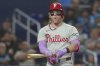 Philadelphia Phillies outfielder Harrison Bader (2) reacts after striking out during the fifth inning of a baseball game against the Miami Marlins Friday, Sept. 5, 2025, in Miami. (AP Photo/Marta Lavandier)