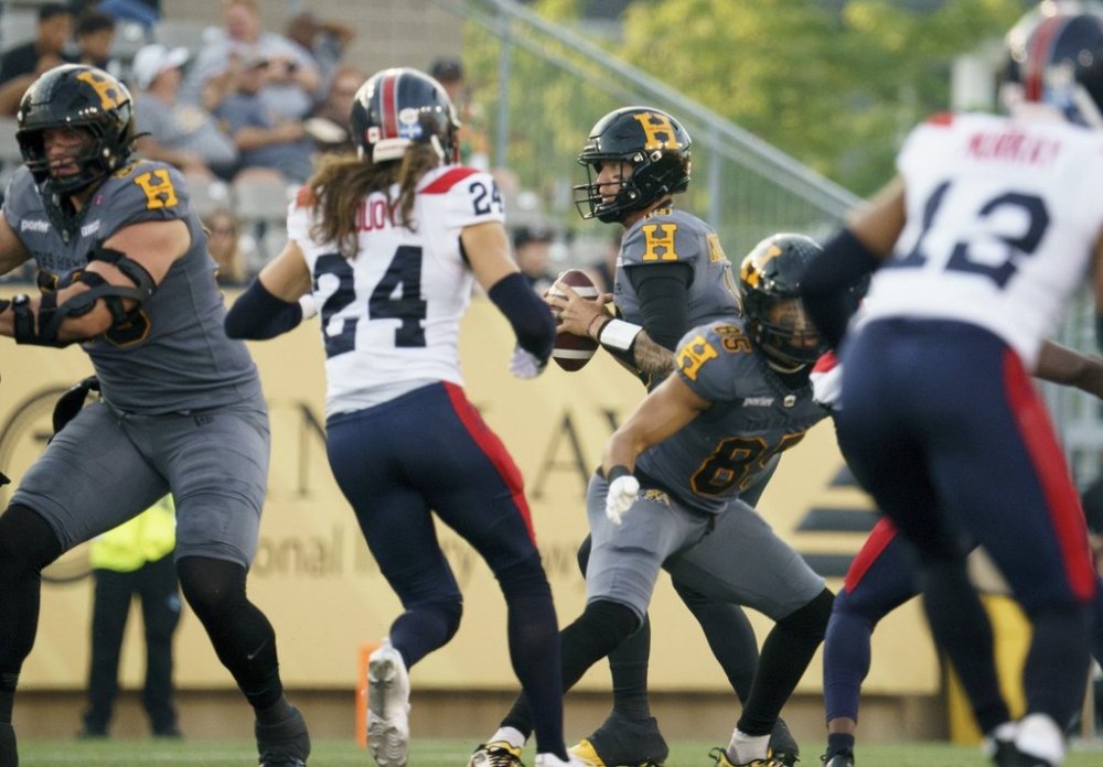 Hamilton Tiger-Cats quarterback Bo Levi Mitchell (19) looks to pass during first half CFL football game action against the Montreal Alouettes in Hamilton, Ont. on Friday, June 27, 2025. THE CANADIAN PRESS/Peter Power