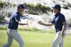 The USA team's Mason Howell, left, shakes hands with Jacob Modleski during Walker Cup golf matches against the Great Britain and Ireland team at Cypress Point Club on Sunday, Sept. 7, 2025, in Pebble Beach, Calif. (AP Photo/Thien-An Truong )