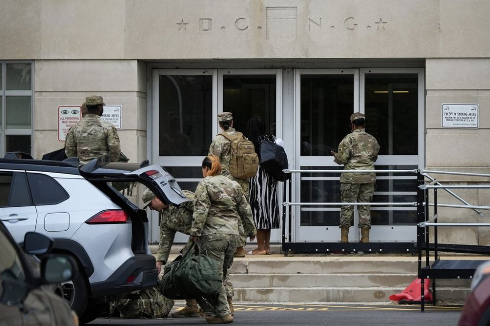 National Guard troops arrive at the District of Columbia National Guard Headquarters, Tuesday, Aug. 12, 2025, in Washington. (AP Photo/Julia Demaree Nikhinson)