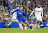 From left to right, Leeds United's Brenden Aaronson, Everton's Jack Grealish and Leeds United's Jayden Bogle battle for the ball during the English Premier League soccer match between Leeds United and Everton at Elland Road in Leeds, England, Monday, Aug. 18, 2025. (Danny Lawson/PA via AP)