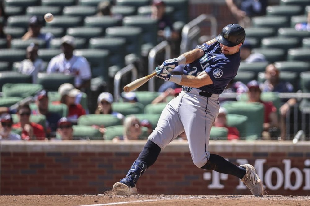Seattle Mariners' Cal Raleigh hits a three-run home run in the ninth inning of a baseball game against the Atlanta Braves, Sunday, Sept. 7, 2025, in Atlanta. (AP Photo/Colin Hubbard)